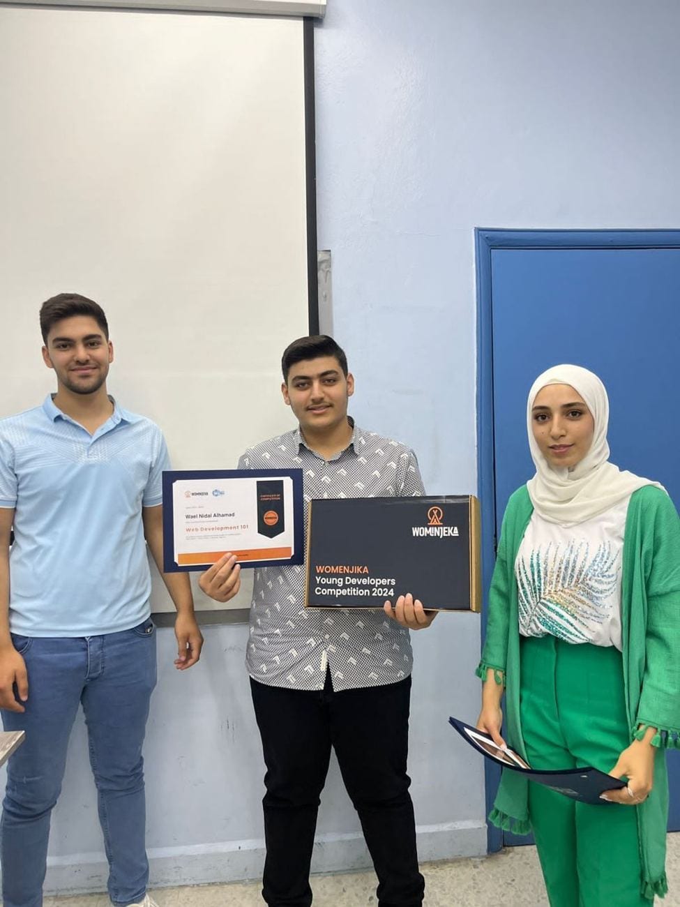 Students with their certificates at the Young Developers Competition, 2024